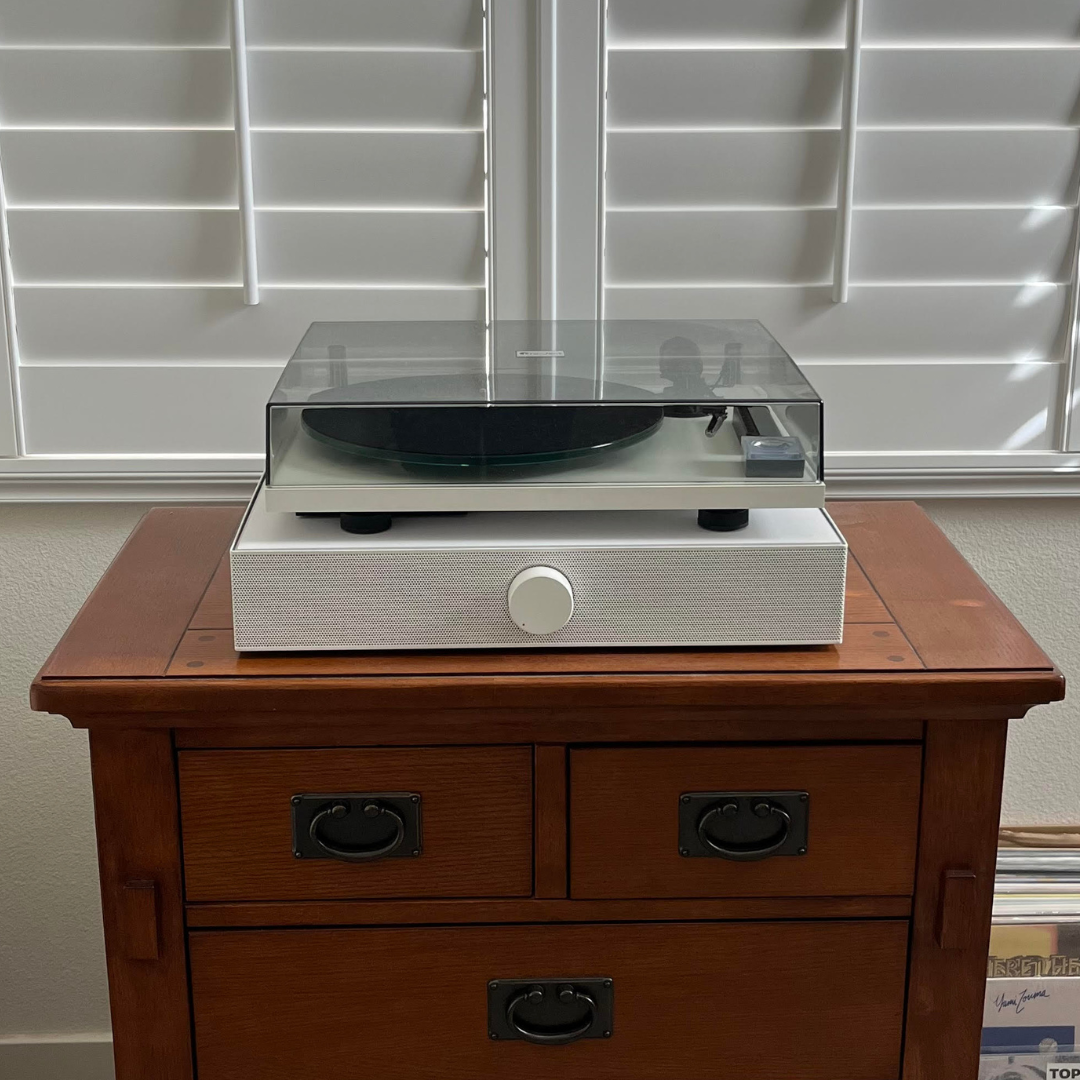 record player with speakers. turntable with speakers. turntable on top of speakers. best all in one record player.